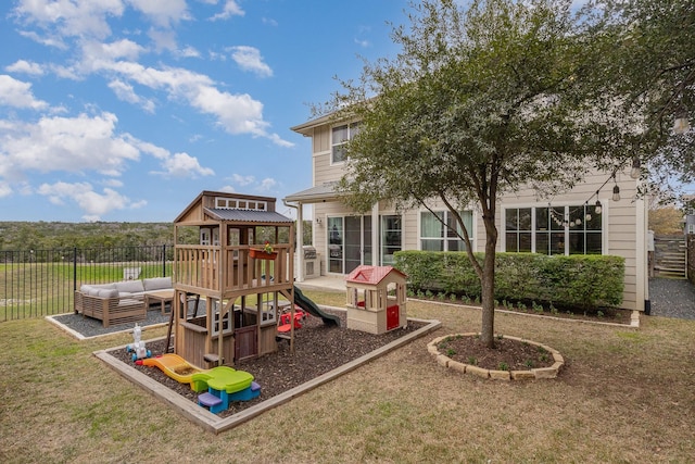 view of jungle gym featuring a lawn