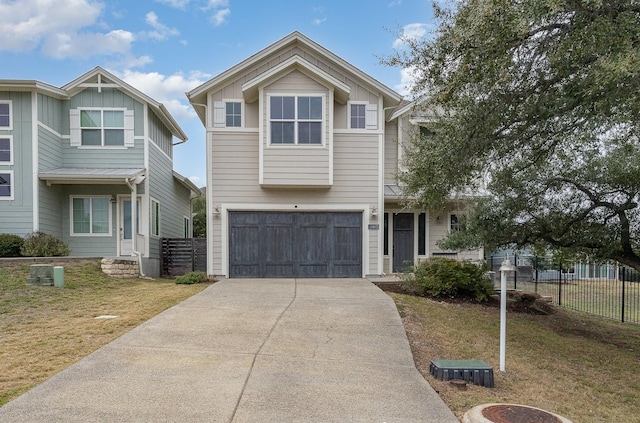 view of front of house with a garage and a front lawn