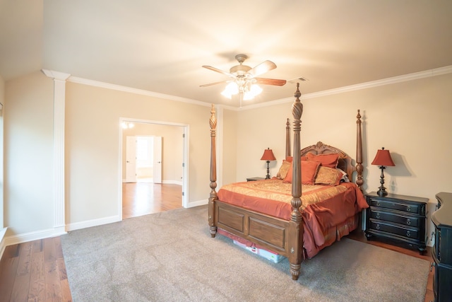 bedroom featuring ornamental molding, wood-type flooring, and ceiling fan