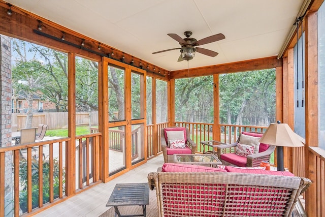 sunroom / solarium with ceiling fan