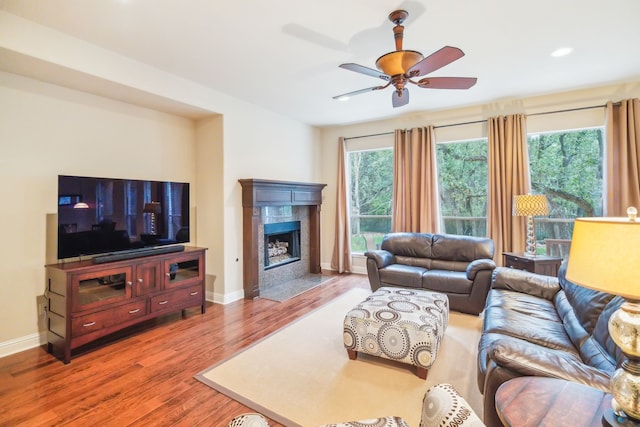 living room with hardwood / wood-style floors and ceiling fan