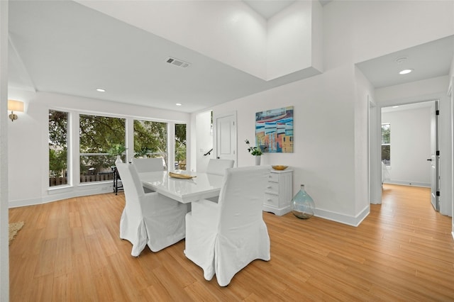 dining area featuring recessed lighting, light wood-type flooring, baseboards, and visible vents