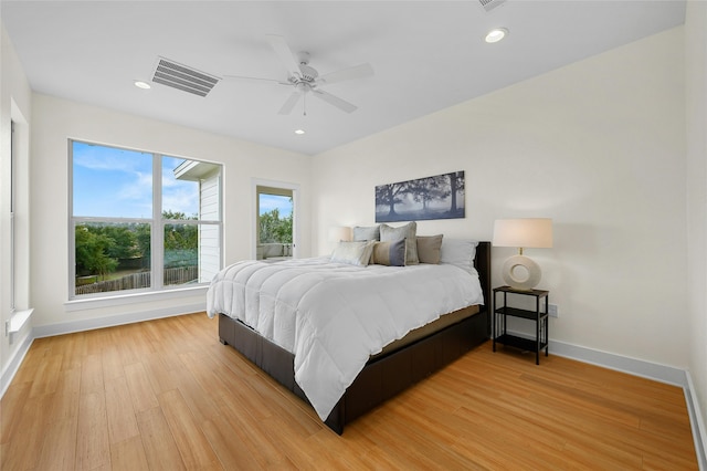 bedroom featuring light wood-type flooring and ceiling fan