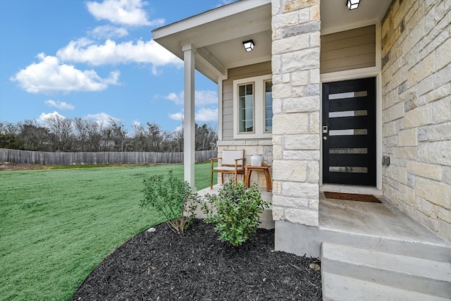 property entrance with a yard