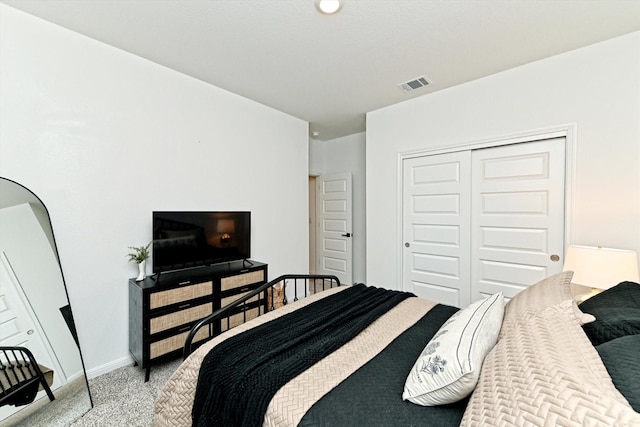 carpeted bedroom featuring a closet