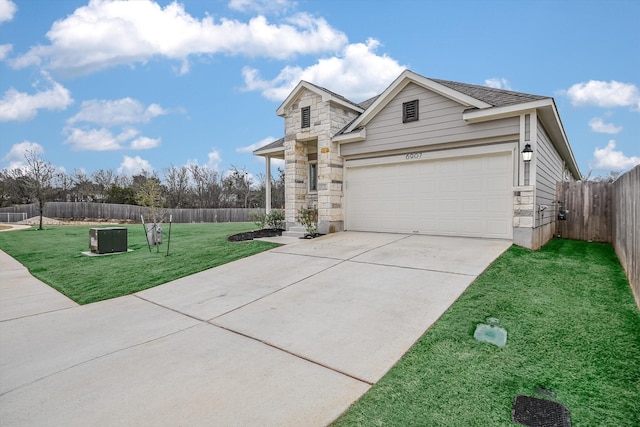 view of front of property with a garage and a front yard