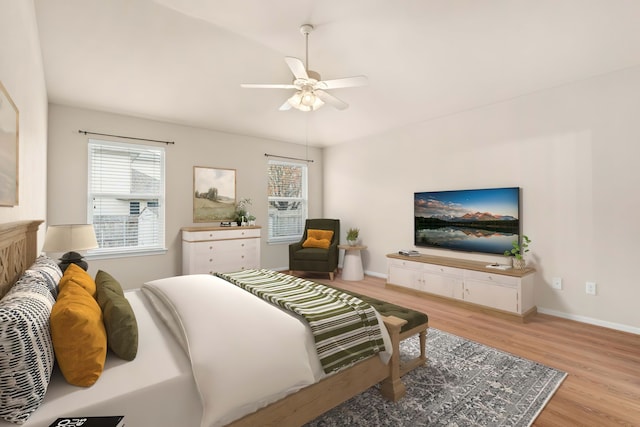 bedroom with ceiling fan and light wood-type flooring