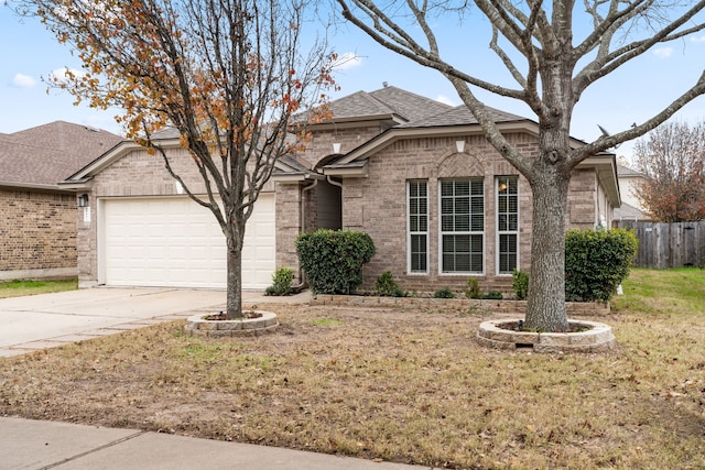 view of front facade with a garage and a front yard