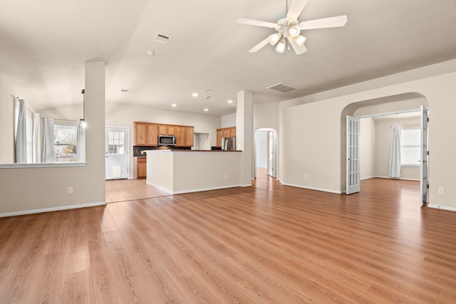 unfurnished living room with light hardwood / wood-style floors and ceiling fan