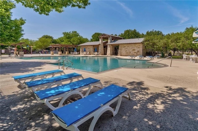 view of swimming pool with a patio area