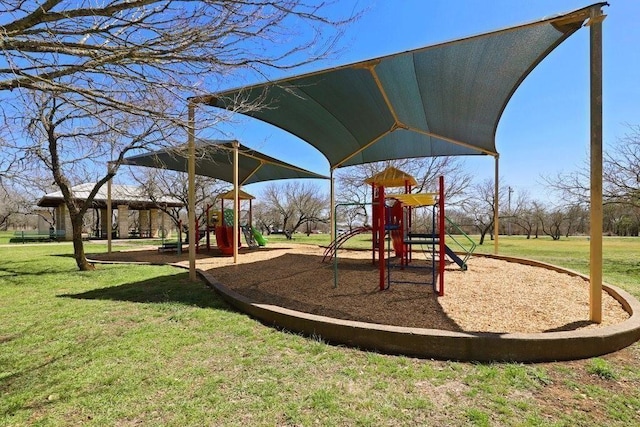 view of playground featuring a lawn