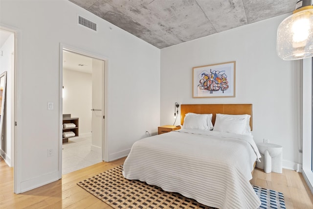 bedroom with light hardwood / wood-style flooring