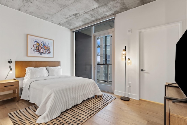 bedroom with light hardwood / wood-style flooring