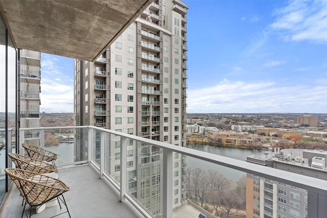 balcony featuring a water view