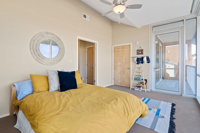 bedroom featuring dark carpet, ceiling fan, and vaulted ceiling