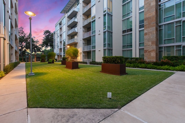 view of property's community with a yard