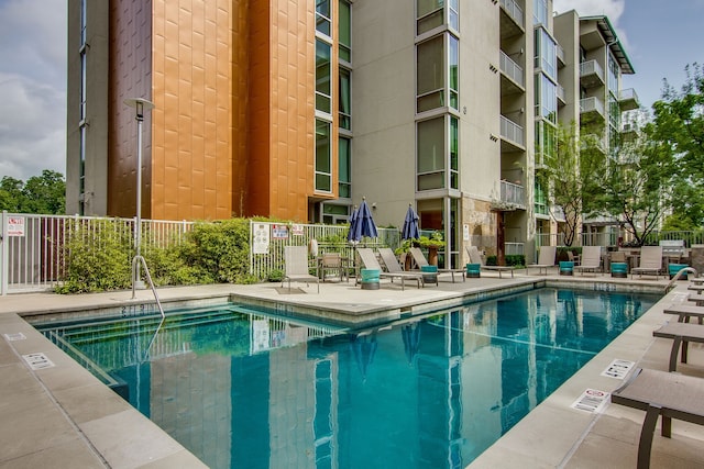 view of swimming pool featuring a patio area