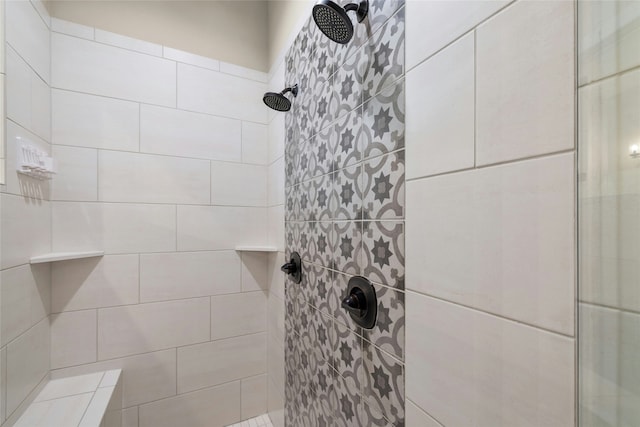 bathroom with a tile shower