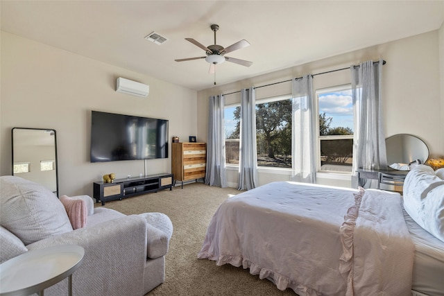 carpeted bedroom with a wall mounted AC and ceiling fan