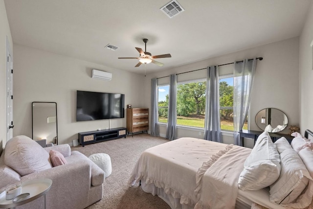 105 Aldea St, Georgetown, TX 78633 - bedroom featuring light colored carpet, a wall unit AC, and a ceiling fan