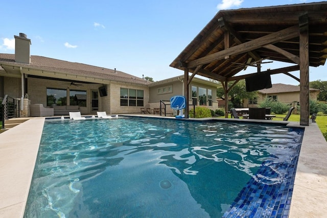 105 Aldea St, Georgetown, TX 78633 - swimming pool featuring a ceiling fan, an outdoor living space, and a patio