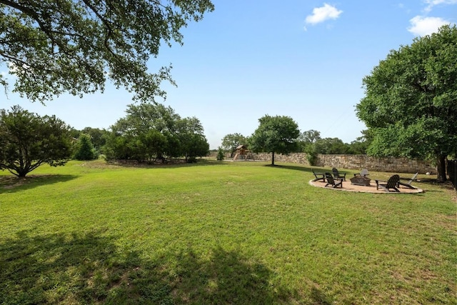 105 Aldea St, Georgetown, TX 78633 - view of green lawn featuring an outdoor fire pit