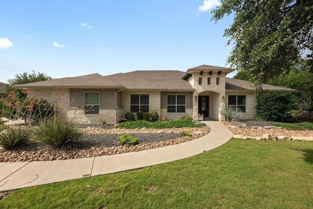 105 Aldea St, Georgetown, TX 78633 - view of front of property with stone siding and a front yard