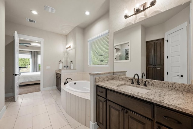 105 Aldea St, Georgetown, TX 78633 - ensuite bathroom featuring a bath, vanity, recessed lighting, and tile patterned flooring
