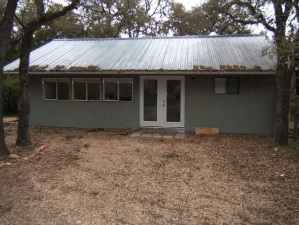 2611 N Cuernavaca Dr, Austin, TX 78733 - back of house with french doors, stucco siding, and a metal roof