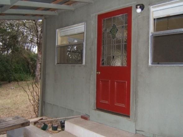 2611 N Cuernavaca Dr, Austin, TX 78733 - doorway to property with stucco siding