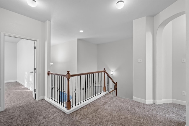 corridor with recessed lighting, carpet, an upstairs landing, and baseboards