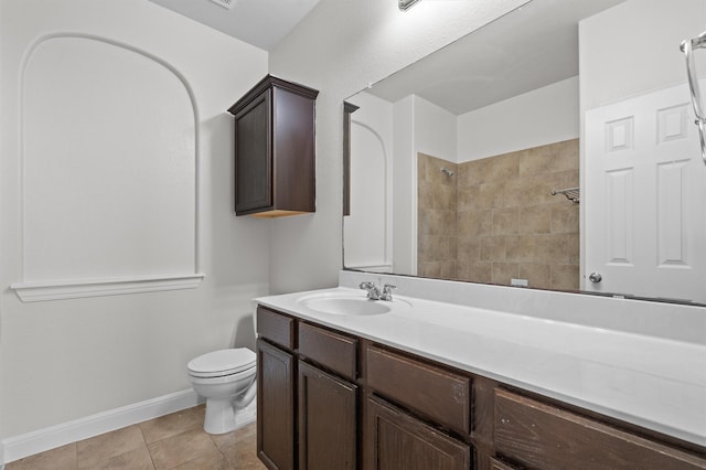 full bath with baseboards, a shower, toilet, tile patterned floors, and vanity