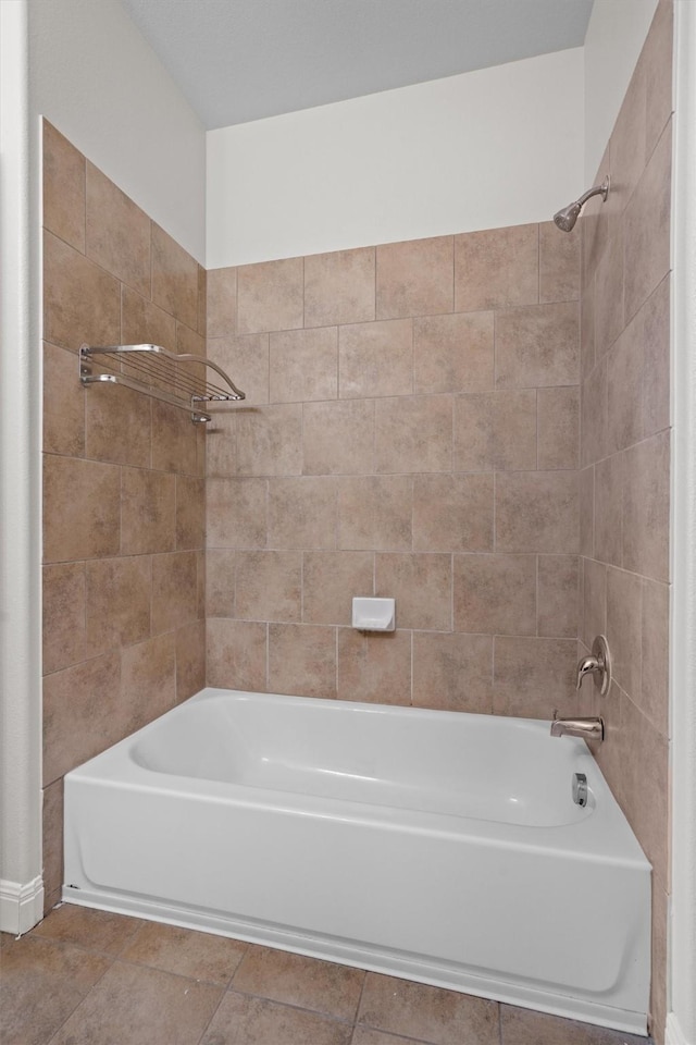 full bath featuring tile patterned flooring and shower / bathtub combination