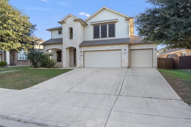 view of front facade with a garage and a front yard