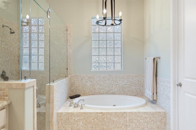 bathroom featuring plus walk in shower and vanity