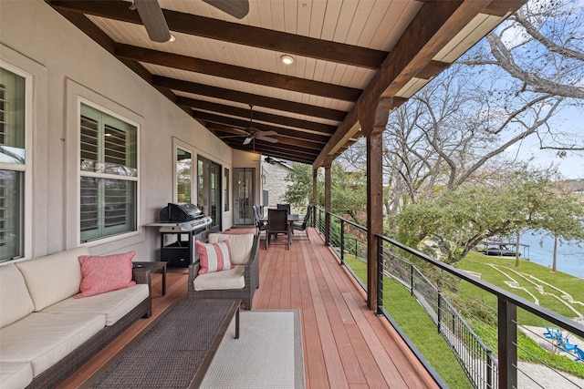 wooden terrace featuring ceiling fan, outdoor lounge area, and area for grilling