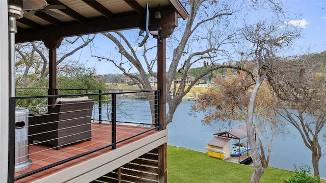 exterior space featuring central air condition unit and a water view