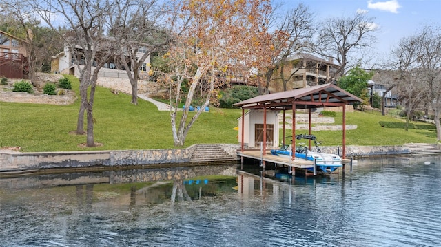 view of dock featuring a water view, a gazebo, and a lawn