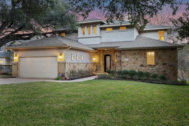 2007 Big Horn Dr, Austin, TX 78734 - prairie-style home featuring stone siding, an attached garage, stucco siding, driveway, and a yard