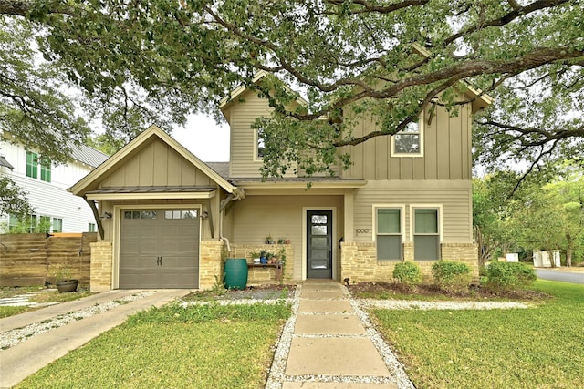 craftsman-style house featuring a garage and a front yard