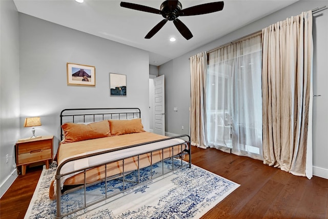 bedroom with dark wood-type flooring and ceiling fan