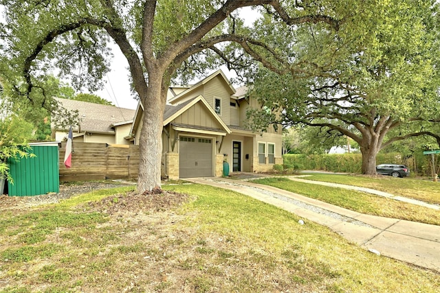 view of front facade with a garage and a front yard