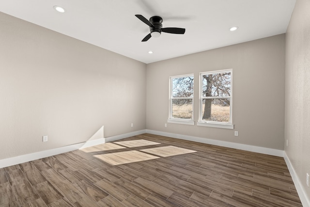 unfurnished room with hardwood / wood-style flooring and ceiling fan