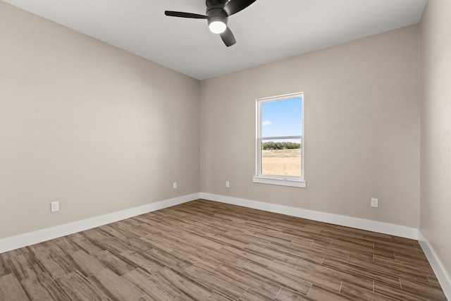 unfurnished room with ceiling fan and light wood-type flooring