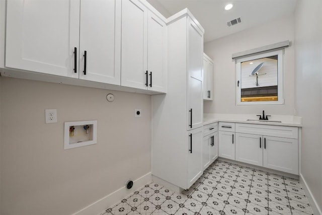 104 Cactus Cor, Horseshoe Bay, TX 78657 - laundry room featuring cabinet space, baseboards, hookup for an electric dryer, hookup for a washing machine, and light floors