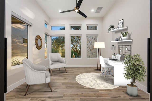 office space featuring light hardwood / wood-style floors and ceiling fan