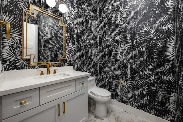 bathroom featuring vanity and toilet