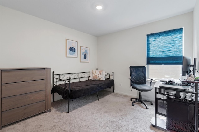 bedroom featuring light carpet