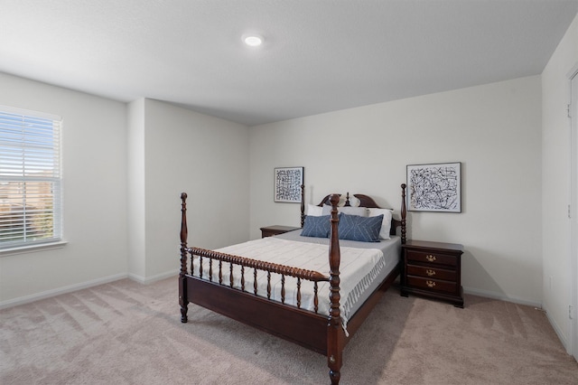 bedroom featuring light colored carpet