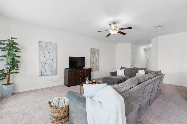 carpeted living room featuring ceiling fan